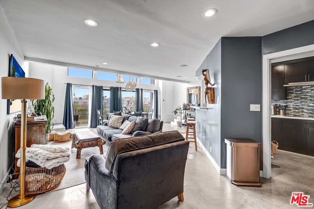 4105 Pacific Avenue, Unit 1 Marina del Rey, CA 90292 - Photo 4 of 29 a living room with furniture and a large window