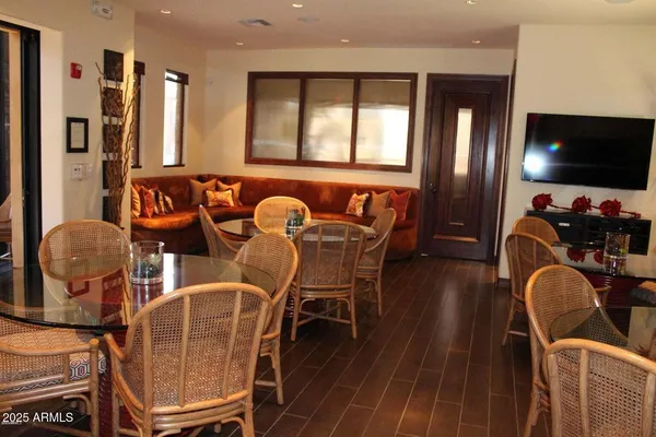 a view of a dining room with furniture and wooden floor