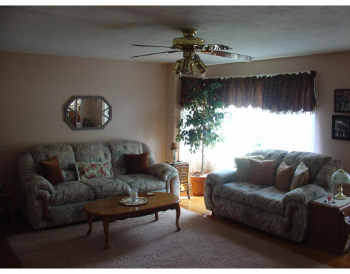 270 Oak Street Springfield, MA 01151 - Photo 2 of 11 a living room with furniture and a large window
