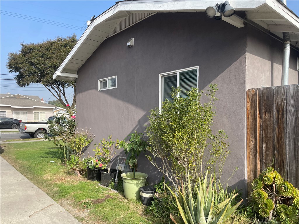 9520 Mayne Street Bellflower, CA 90706 - Photo 6 of 6 a front view of a house with garden