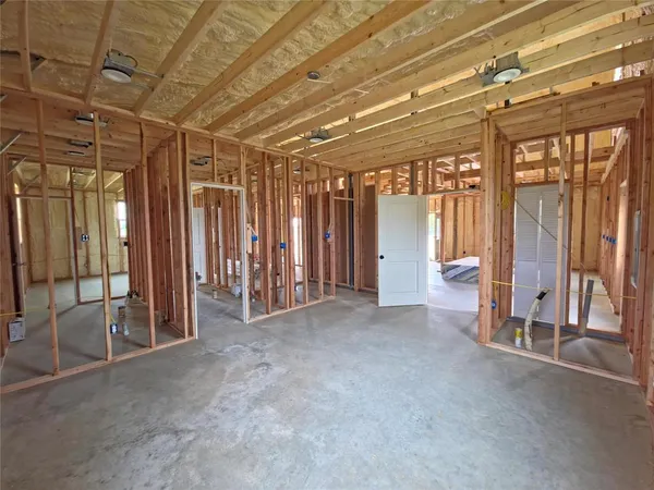 a view of an empty room with glass door