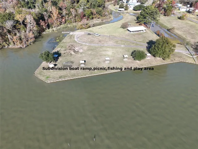 a living room with furniture a rug and a large window