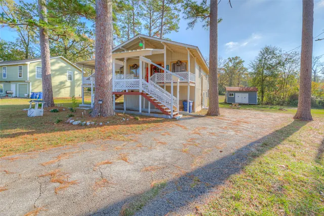 a view of a chairs and table on the wooden deck