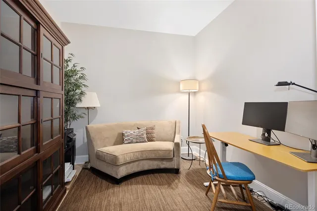 a bedroom with furniture and a wooden floor