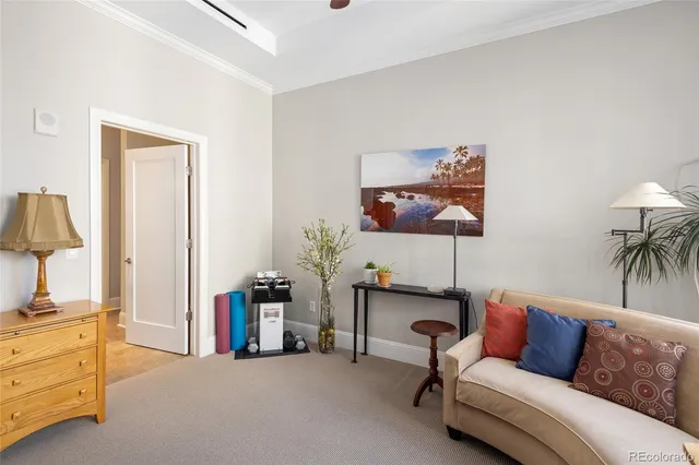 a living room with furniture and a lamp