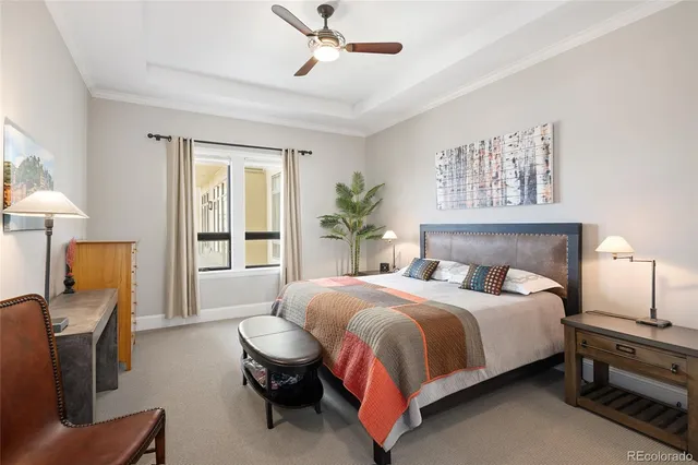 a bedroom with a bed wooden floor and furniture