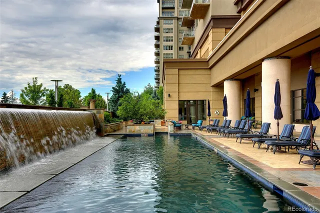 a view of swimming pool with outdoor seating