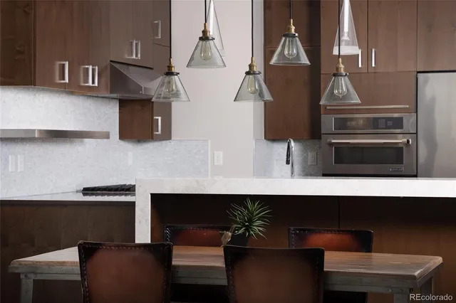 a kitchen with a sink cabinets and stainless steel appliances