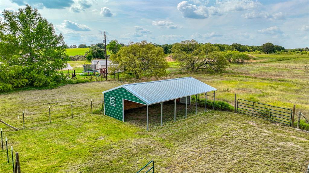 11500 Bowden Road Lipan, TX 76462 - Photo 7 of 32 View of outdoor structure with a yard and a rural view