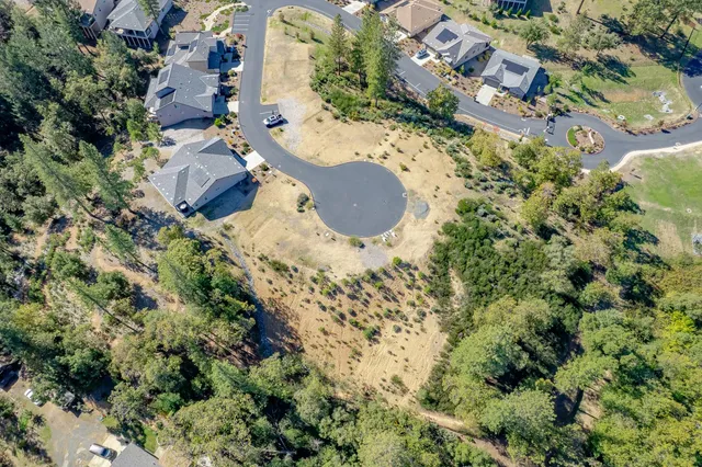 an aerial view of residential house with outdoor space