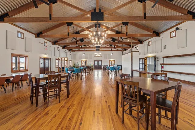 a outdoor space with lots of wooden furniture