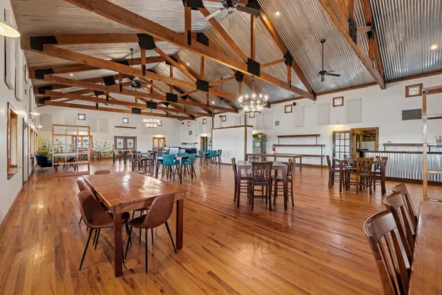 a kitchen with lots of counter top space and wooden floor