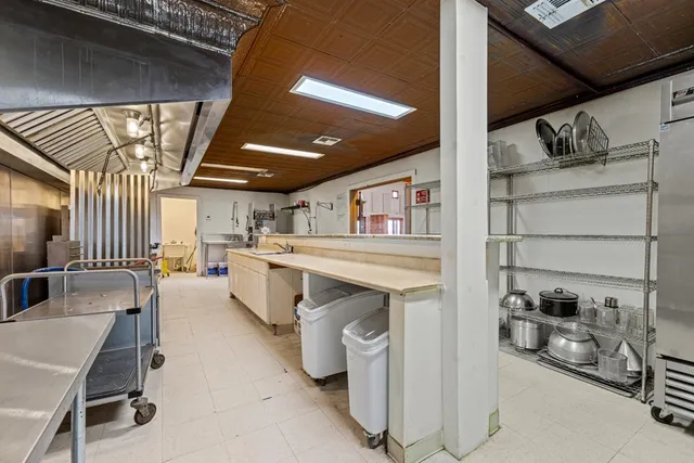 a bathroom with a sink a mirror and shower