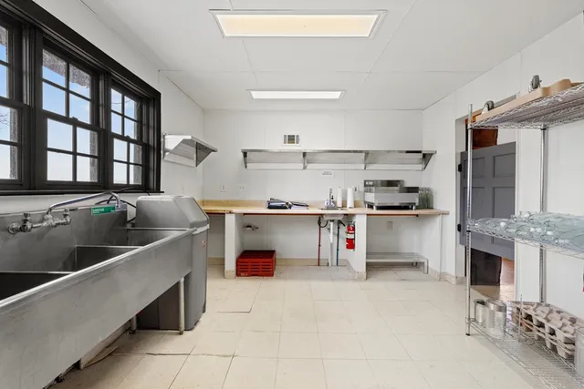 a swimming pool view with a seating space