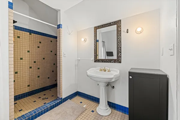 a view of house with yard and swimming pool