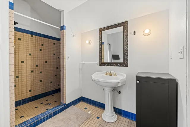 a view of house with yard and swimming pool