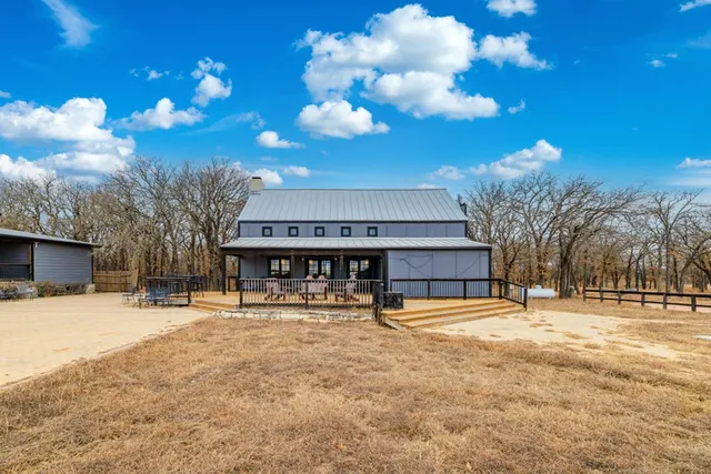 a view of kitchen with microwave a stove and furniture