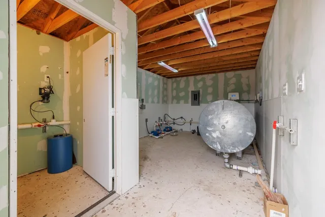 a view of a hallway with washer and dryer