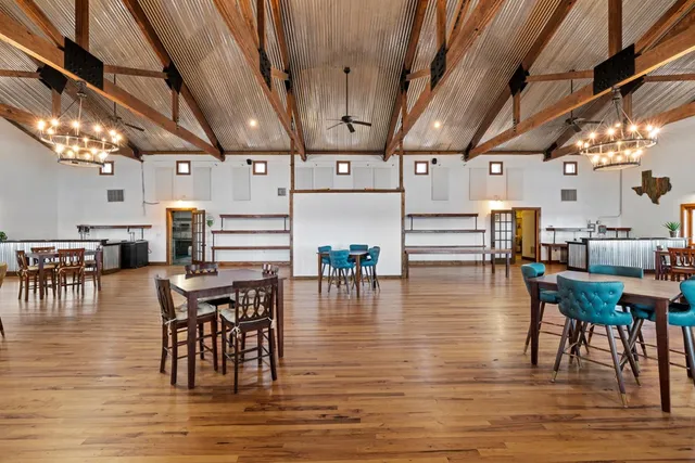 a view of a patio with table and chairs with wooden floor