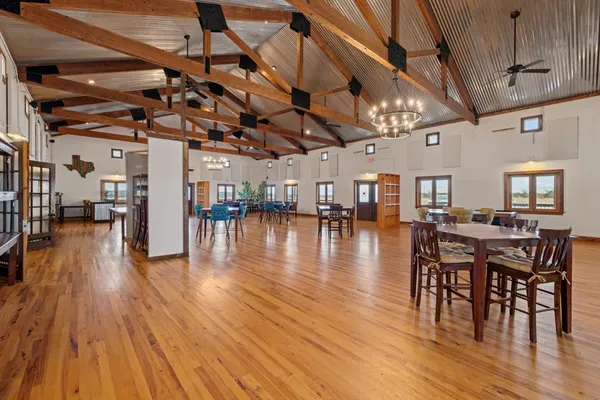 a outdoor space with lots of wooden furniture