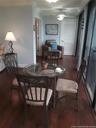 a view of a dining room with furniture and chandelier