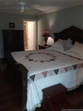 a bedroom with a bed and a dresser