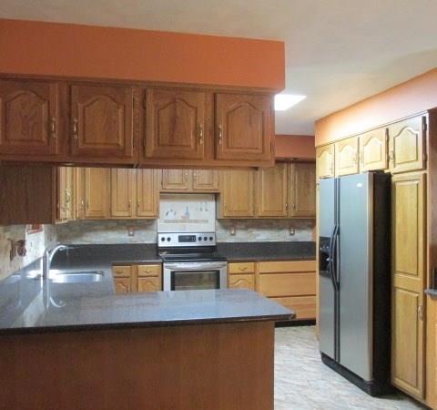 257 Conover Pass Road Acme, PA 15610 - Photo 11 of 25 Plenty of cabinets for storage and quartz counter tops for ample workspace