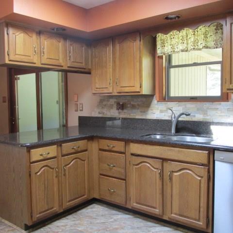 257 Conover Pass Road Acme, PA 15610 - Photo 12 of 25 This Kitchen has a beautiful natural stone backsplash, quartz counters and more quality features to be seen