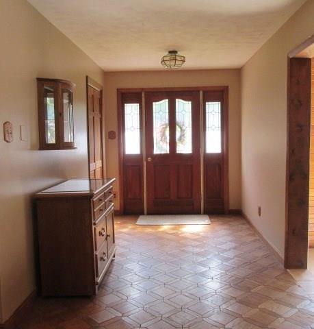 257 Conover Pass Road Acme, PA 15610 - Photo 3 of 25 Step into the spacious foyer with hall closet and space for guests to enter with ease.