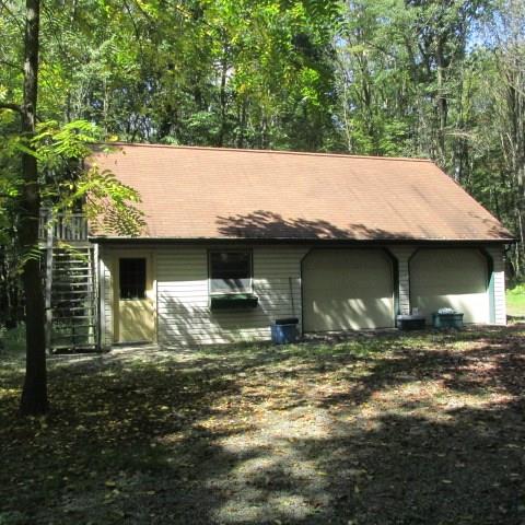 257 Conover Pass Road Acme, PA 15610 - Photo 24 of 25 2 car integral Garage along with an over-sized 2 car Garage with workshop and more storage above.