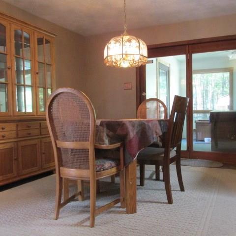 257 Conover Pass Road Acme, PA 15610 - Photo 9 of 25 French doors from the eating area lead to an enclosed rear room with hot tub