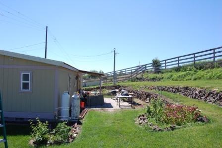 18580 Summitview Road Tieton, WA 98947 - Photo 4 of 19 a view of a patio with table and chairs potted plants