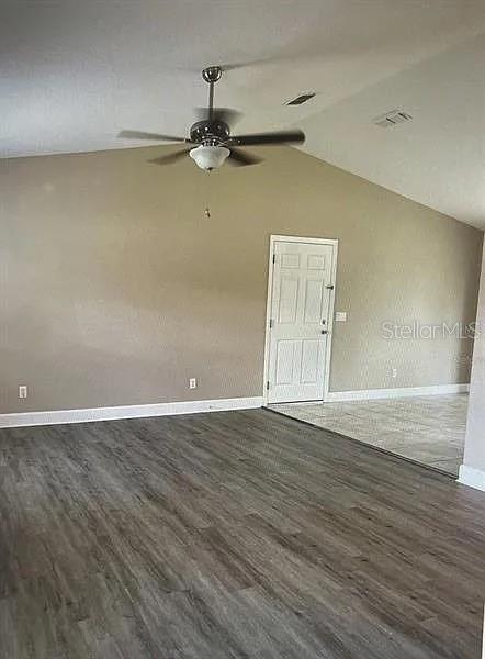 96 Redwood Road Ocala, FL 34472 - Photo 4 of 10 wooden floor in an empty room