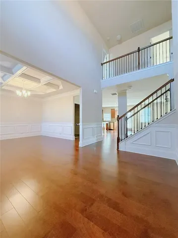 a view of an entryway with wooden floor