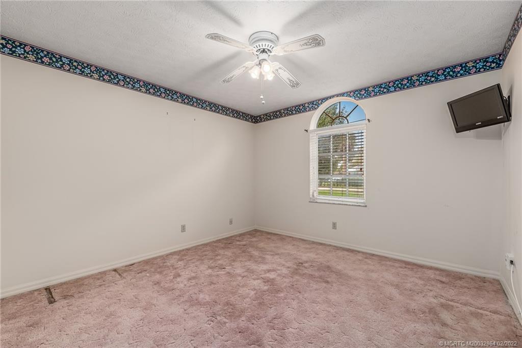 1214 Southwest Locks Road Stuart, FL 34997 - Photo 15 of 29 a view of an empty room with a window