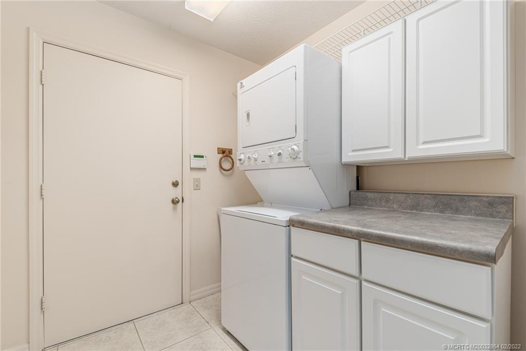1214 Southwest Locks Road Stuart, FL 34997 - Photo 17 of 29 a utility room with dryer and washer