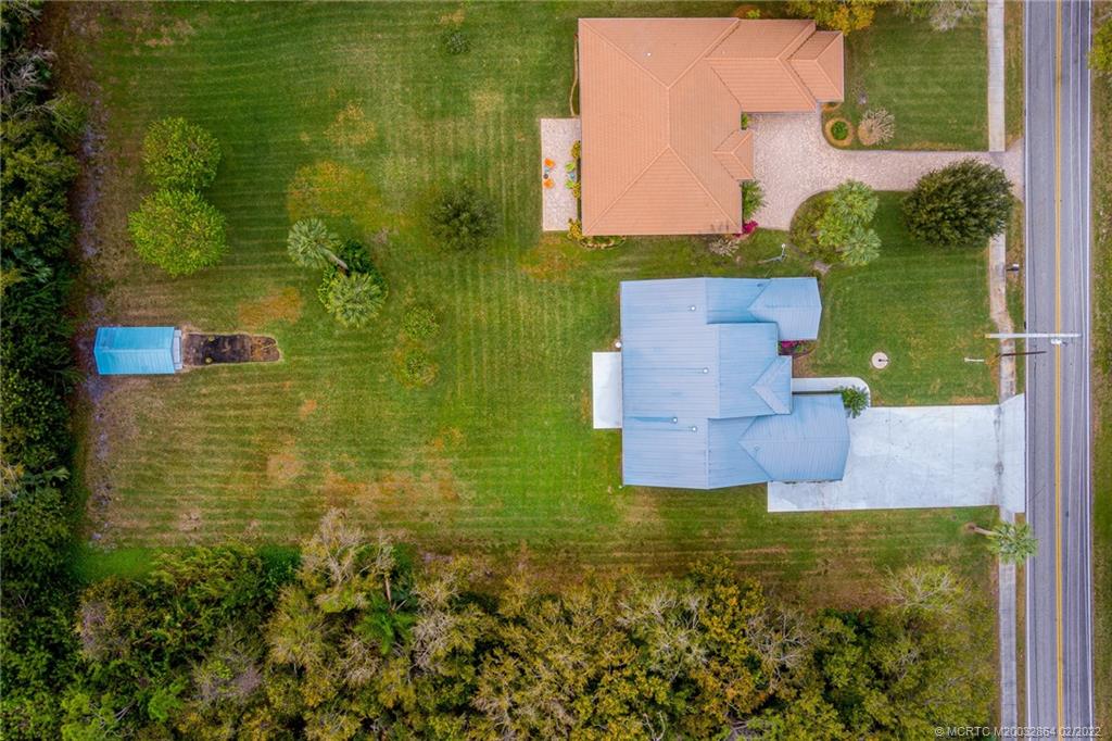 1214 Southwest Locks Road Stuart, FL 34997 - Photo 27 of 29 an aerial view of a house with a yard