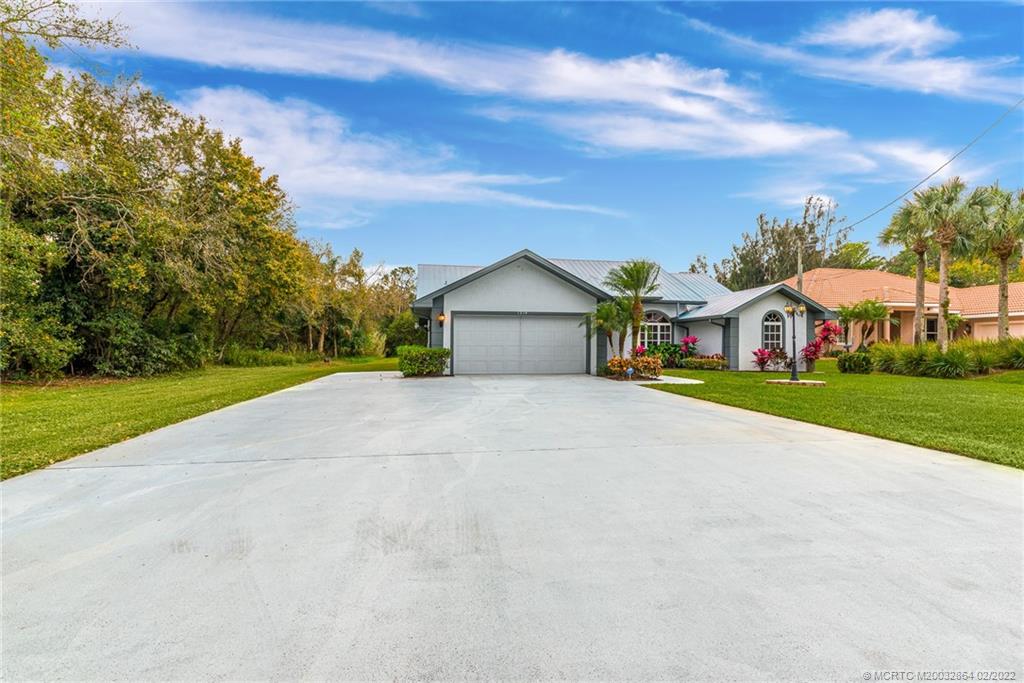 1214 Southwest Locks Road Stuart, FL 34997 - Photo 5 of 29 a view of house with outdoor space and street view