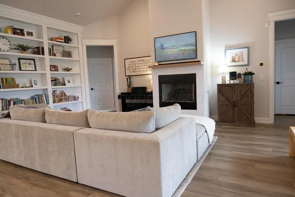 a living room with furniture and a fireplace