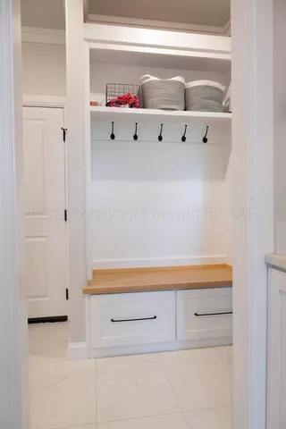 a kitchen with cabinets and window