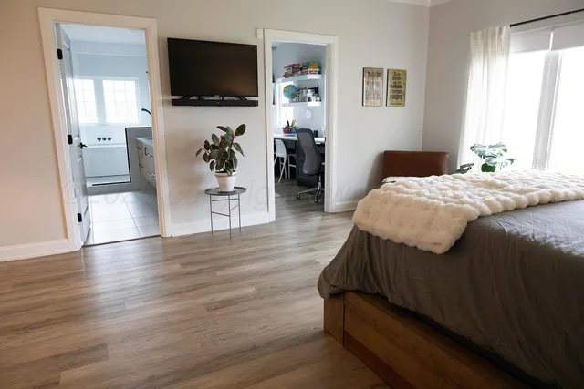 a bedroom with a bed and a couch