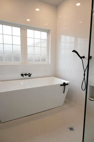 a kitchen with a table and chairs