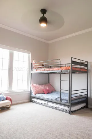 a bedroom with a bed and a table
