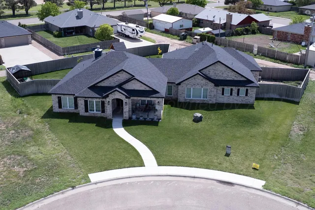 a kitchen with a table chairs stove and cabinets