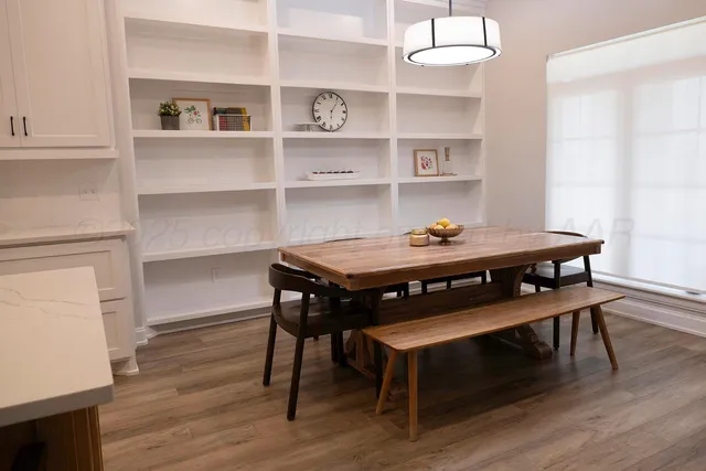 a kitchen with stainless steel appliances granite countertop a refrigerator and a stove