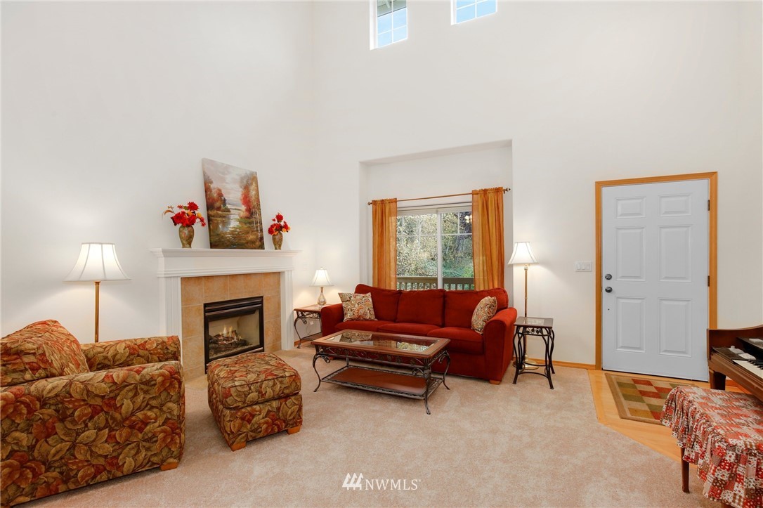 6105 Southeast 3rd Place Renton, WA 98059 - Photo 3 of 24 a living room with furniture and a fireplace