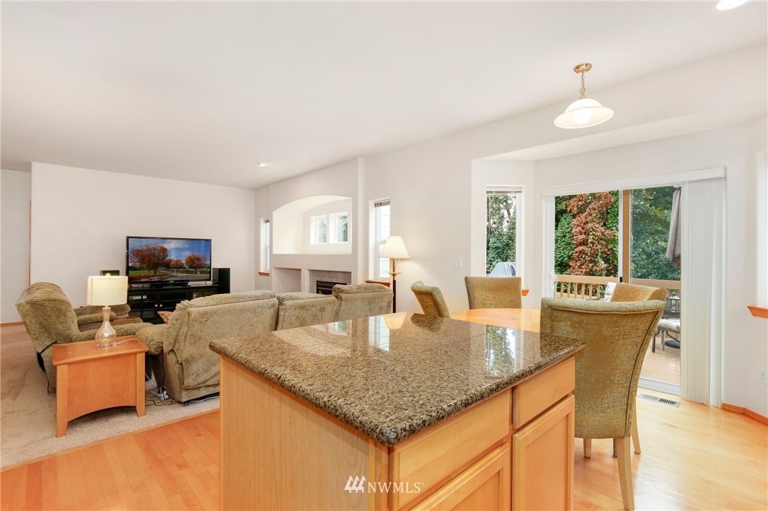 6105 Southeast 3rd Place Renton, WA 98059 - Photo 8 of 24 a dining room with furniture and a flat screen tv