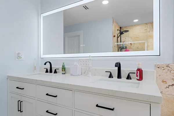 a bathroom with a bathtub and a sink