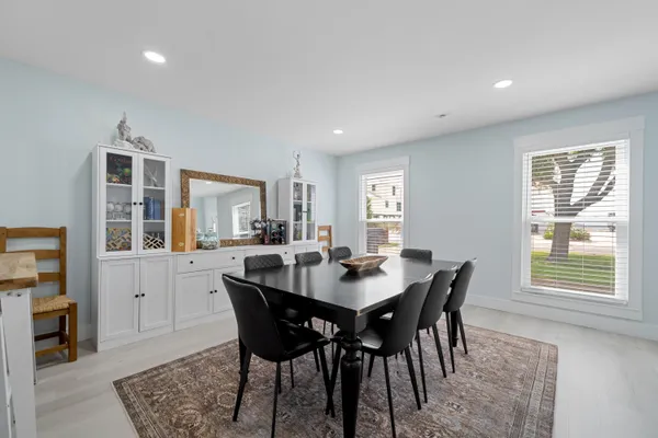 a view of a dining room with furniture and window