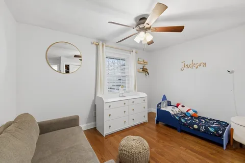 a bedroom with furniture and a window